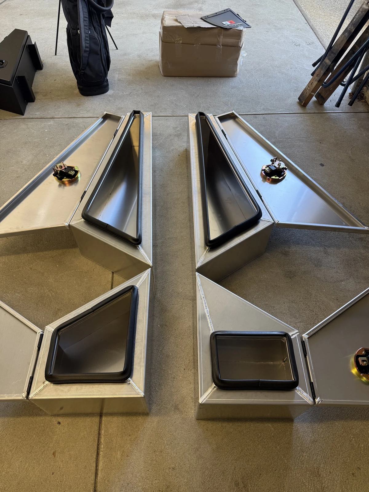 Raw fabricated aluminium underbody toolboxes in the workshop
