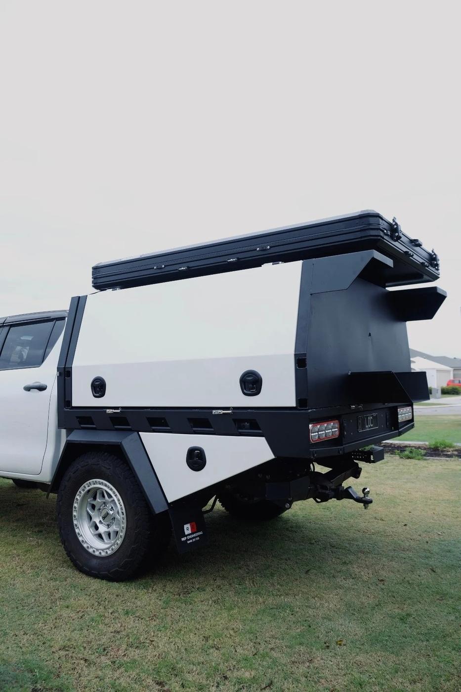 White and black two-tone canopy on a Hilux