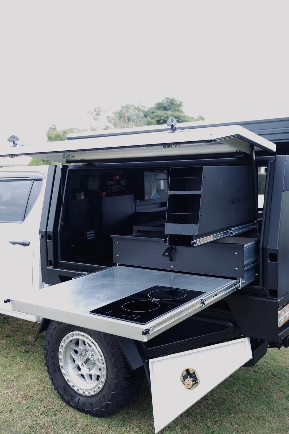 Slide-out kitchen on a Rep Engineering canopy