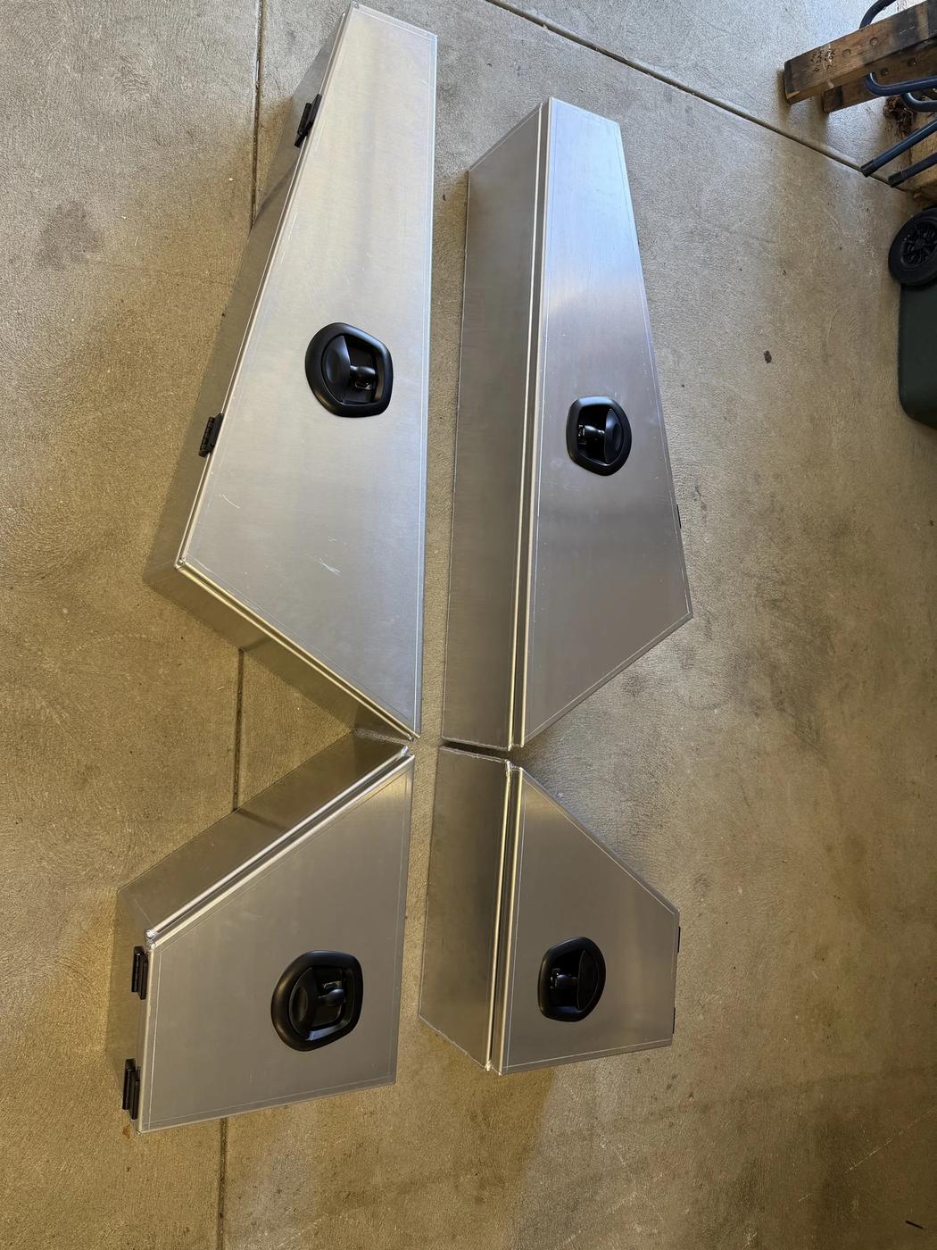 Freshly fabricated aluminium toolboxes on the workshop floor