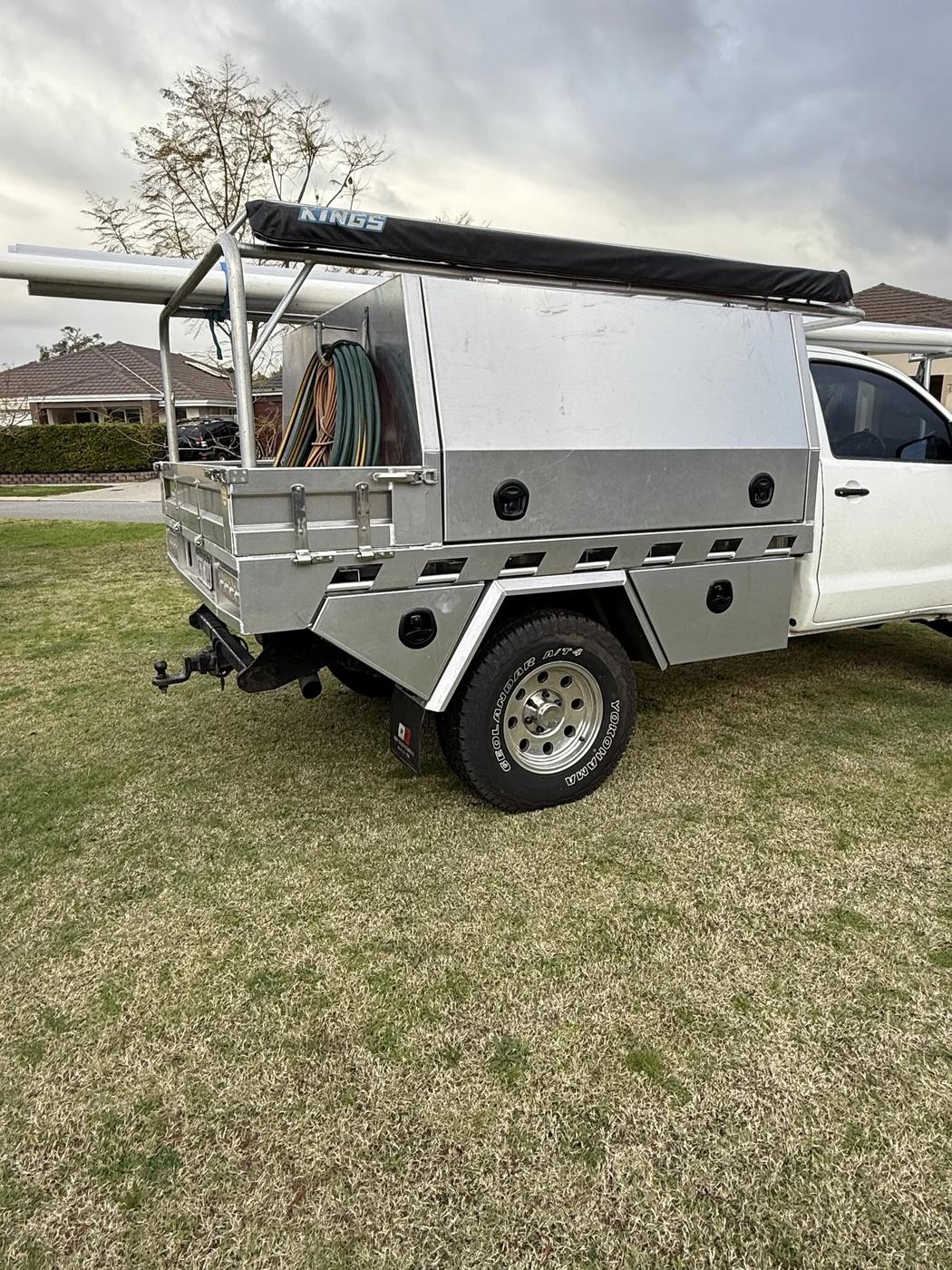 Trade canopy with ladder rack and awning