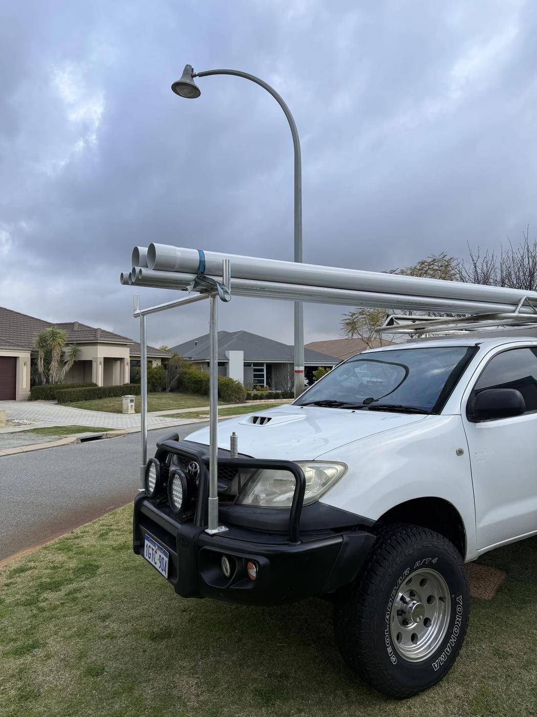 Hilux single cab canopy & awning: rack loaded with pipe