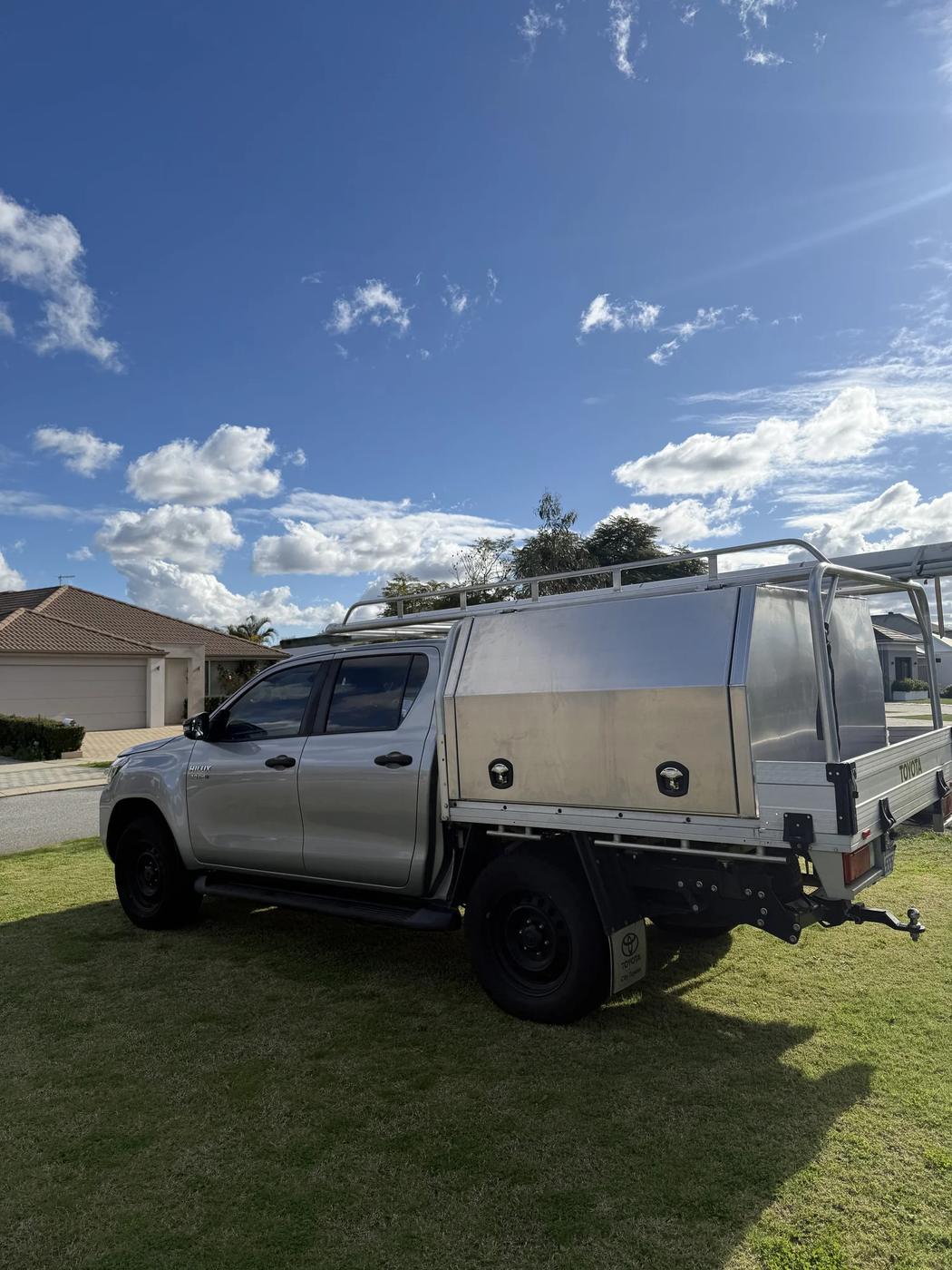 Raw aluminium canopy on a silver Hilux