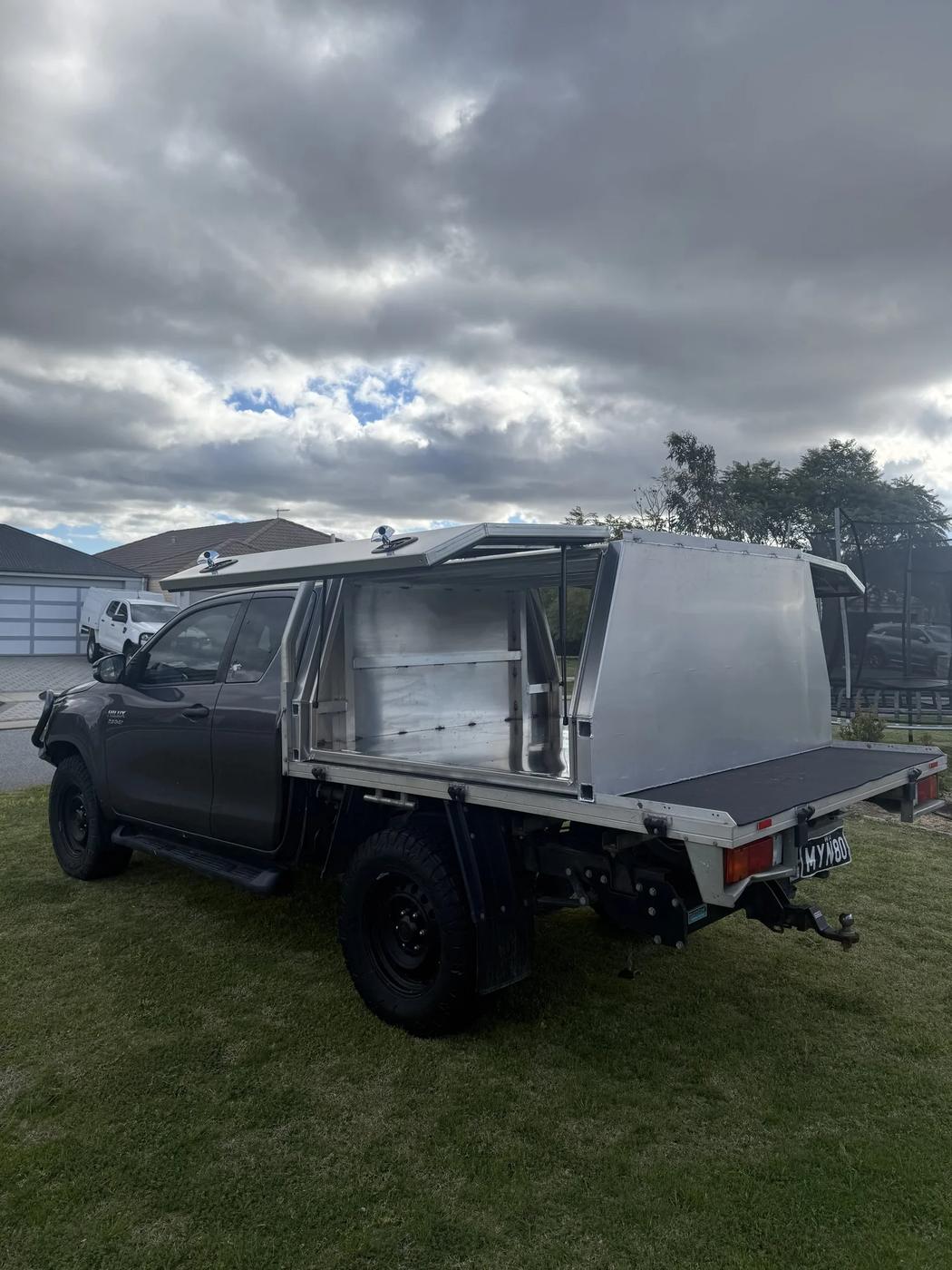 Grey dual cab with raw aluminium canopy