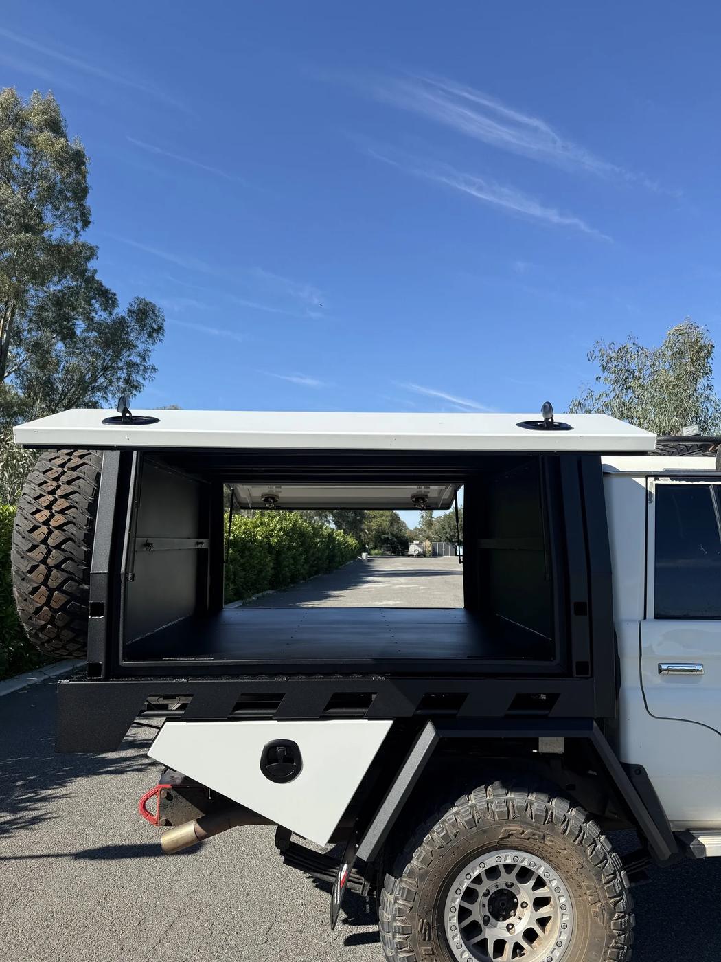 Black powder-coated canopy on a LandCruiser